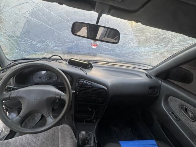 Синий Мицубиси Лансер, объемом двигателя 1.6 л и пробегом 999 тыс. км за 594 $, фото 18 на Automoto.ua