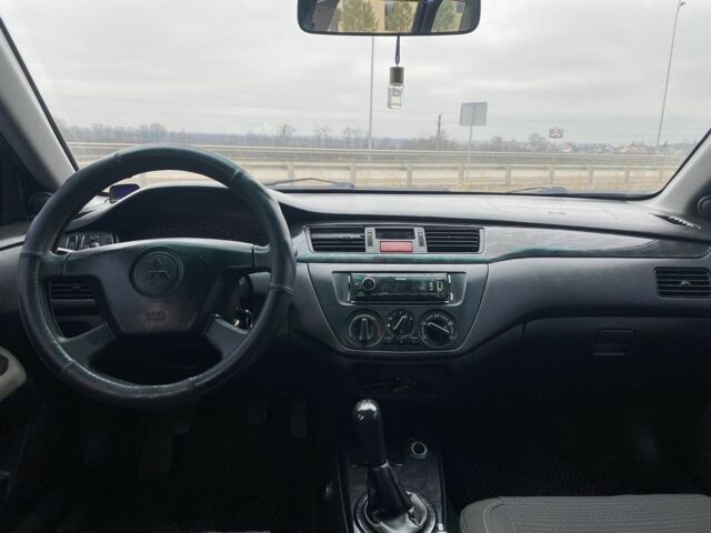 Синий Мицубиси Лансер, объемом двигателя 1.6 л и пробегом 240 тыс. км за 2600 $, фото 6 на Automoto.ua