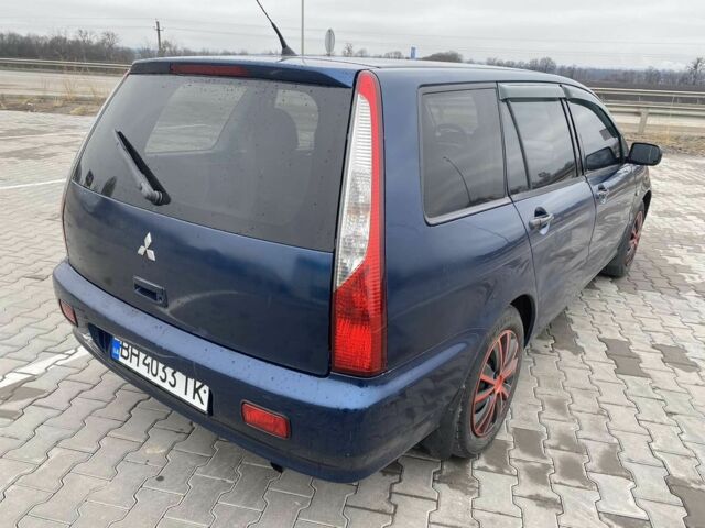 Синий Мицубиси Лансер, объемом двигателя 1.6 л и пробегом 240 тыс. км за 2600 $, фото 1 на Automoto.ua