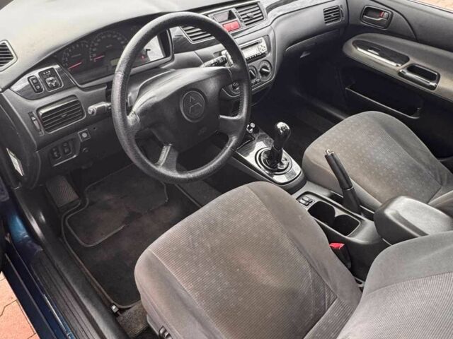 Синій Міцубісі Lancer, об'ємом двигуна 1.6 л та пробігом 220 тис. км за 2399 $, фото 3 на Automoto.ua