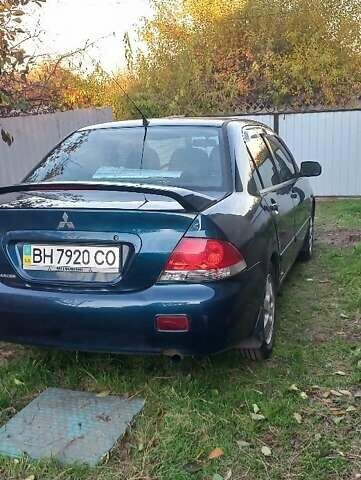 Синий Мицубиси Лансер, объемом двигателя 2 л и пробегом 237 тыс. км за 3499 $, фото 7 на Automoto.ua