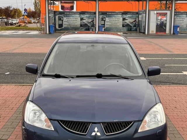 Синій Міцубісі Lancer, об'ємом двигуна 1.6 л та пробігом 220 тис. км за 2399 $, фото 5 на Automoto.ua