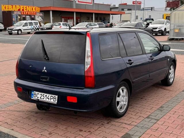 Синій Міцубісі Lancer, об'ємом двигуна 1.6 л та пробігом 220 тис. км за 2399 $, фото 2 на Automoto.ua