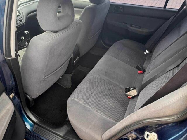 Синій Міцубісі Lancer, об'ємом двигуна 1.6 л та пробігом 220 тис. км за 2399 $, фото 4 на Automoto.ua