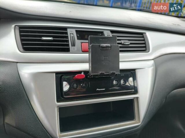 Синій Міцубісі Lancer, об'ємом двигуна 1.6 л та пробігом 258 тис. км за 3000 $, фото 17 на Automoto.ua