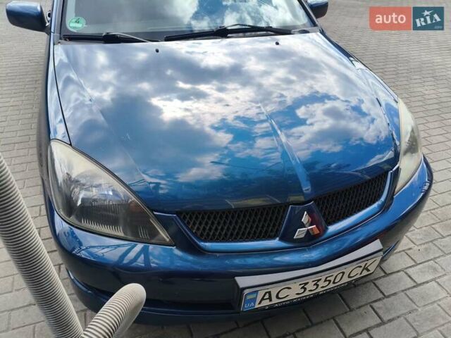 Синій Міцубісі Lancer, об'ємом двигуна 1.6 л та пробігом 258 тис. км за 4300 $, фото 7 на Automoto.ua