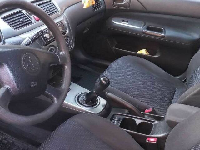 Синій Міцубісі Lancer, об'ємом двигуна 1.6 л та пробігом 245 тис. км за 3299 $, фото 8 на Automoto.ua