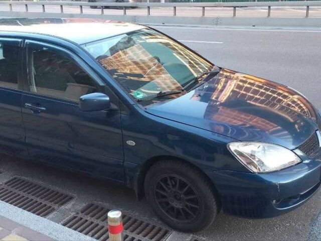 Синій Міцубісі Lancer, об'ємом двигуна 1.6 л та пробігом 245 тис. км за 3299 $, фото 1 на Automoto.ua