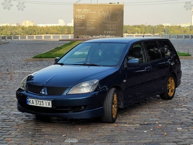 Синій Міцубісі Lancer, об'ємом двигуна 2 л та пробігом 277 тис. км за 5200 $, фото 2 на Automoto.ua