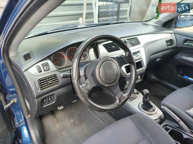 Синій Міцубісі Lancer, об'ємом двигуна 1.6 л та пробігом 258 тис. км за 4300 $, фото 11 на Automoto.ua