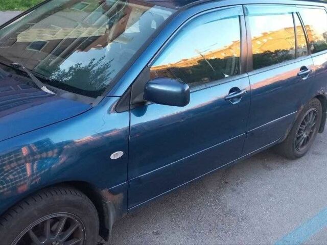 Синій Міцубісі Lancer, об'ємом двигуна 1.6 л та пробігом 245 тис. км за 3299 $, фото 4 на Automoto.ua