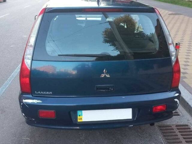 Синій Міцубісі Lancer, об'ємом двигуна 1.6 л та пробігом 245 тис. км за 3299 $, фото 12 на Automoto.ua