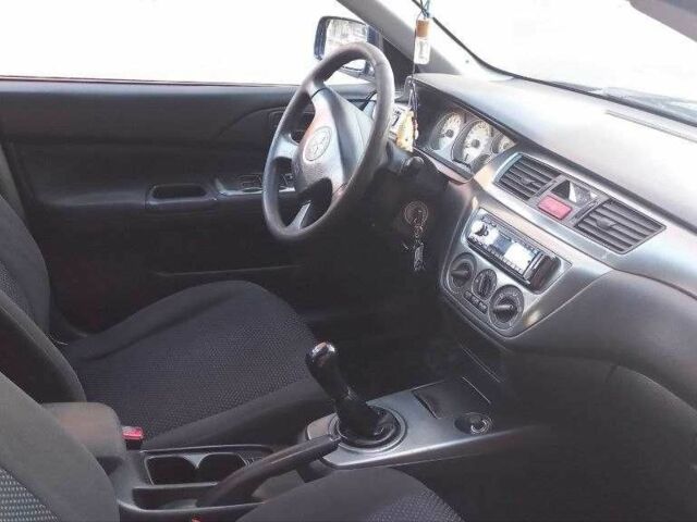 Синій Міцубісі Lancer, об'ємом двигуна 1.6 л та пробігом 245 тис. км за 3299 $, фото 7 на Automoto.ua