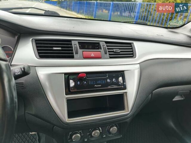 Синій Міцубісі Lancer, об'ємом двигуна 1.6 л та пробігом 258 тис. км за 4300 $, фото 17 на Automoto.ua