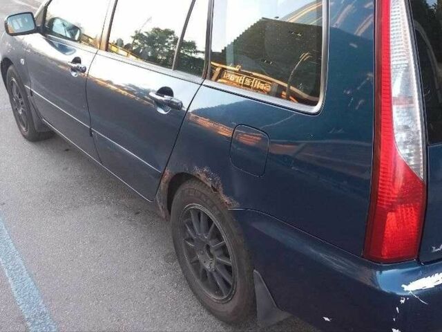 Синій Міцубісі Lancer, об'ємом двигуна 1.6 л та пробігом 245 тис. км за 3299 $, фото 13 на Automoto.ua