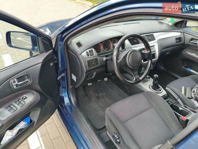 Синій Міцубісі Lancer, об'ємом двигуна 1.6 л та пробігом 258 тис. км за 4300 $, фото 16 на Automoto.ua