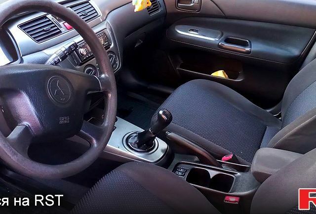Синій Міцубісі Lancer, об'ємом двигуна 1.6 л та пробігом 245 тис. км за 3299 $, фото 4 на Automoto.ua