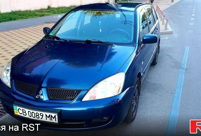 Синій Міцубісі Lancer, об'ємом двигуна 1.6 л та пробігом 245 тис. км за 3299 $, фото 6 на Automoto.ua