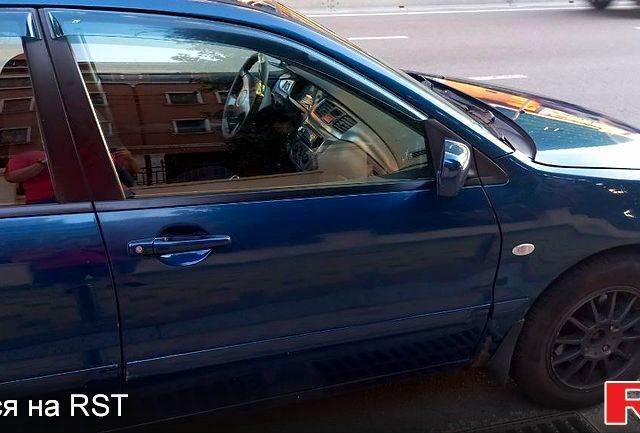 Синій Міцубісі Lancer, об'ємом двигуна 1.6 л та пробігом 245 тис. км за 3299 $, фото 1 на Automoto.ua