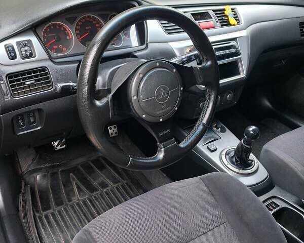 Міцубісі Lancer 2006 у Дніпро (Дніпропетровську) на Automoto.ua Синій Міцубісі Lancer, об'ємом двигуна 1.58 л та пробігом 290 тис. км за 3600 $, фото 9 на Automoto.ua