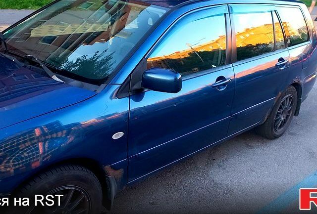 Синій Міцубісі Lancer, об'ємом двигуна 1.6 л та пробігом 245 тис. км за 3299 $, фото 7 на Automoto.ua
