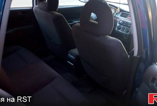 Синій Міцубісі Lancer, об'ємом двигуна 1.6 л та пробігом 245 тис. км за 3299 $, фото 3 на Automoto.ua