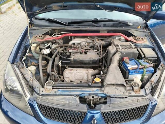 Синій Міцубісі Lancer, об'ємом двигуна 1.6 л та пробігом 258 тис. км за 4300 $, фото 20 на Automoto.ua