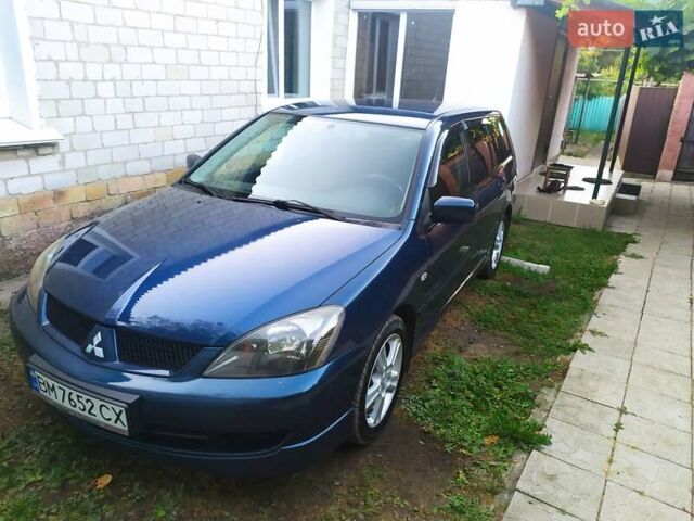 Синій Міцубісі Lancer, об'ємом двигуна 2 л та пробігом 201 тис. км за 4800 $, фото 3 на Automoto.ua