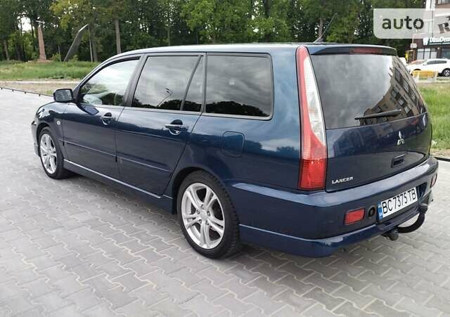 Синій Міцубісі Lancer, об'ємом двигуна 2 л та пробігом 211 тис. км за 3950 $, фото 12 на Automoto.ua