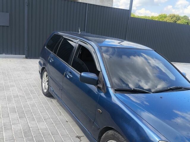 Синій Міцубісі Lancer, об'ємом двигуна 2 л та пробігом 330 тис. км за 4200 $, фото 1 на Automoto.ua