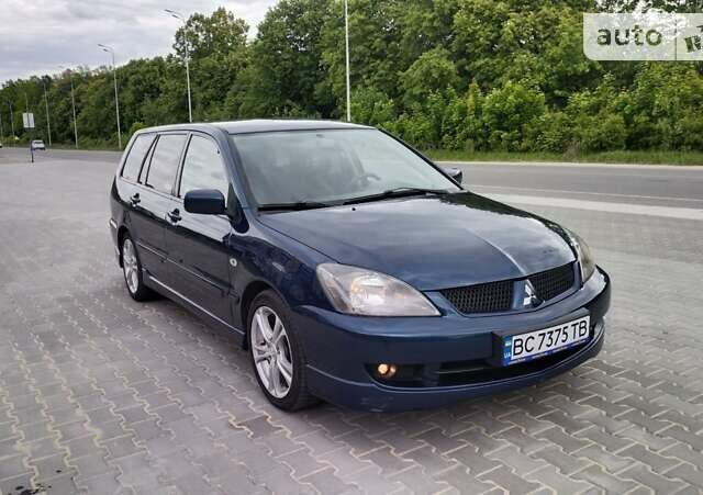 Синій Міцубісі Lancer, об'ємом двигуна 2 л та пробігом 211 тис. км за 3950 $, фото 3 на Automoto.ua