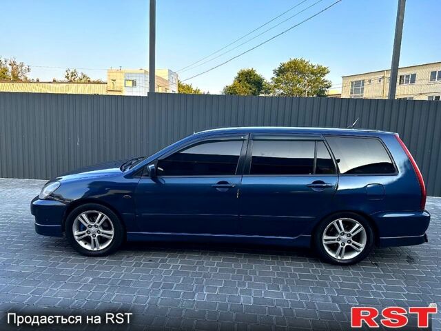 Синий Мицубиси Лансер, объемом двигателя 2 л и пробегом 330 тыс. км за 3400 $, фото 3 на Automoto.ua