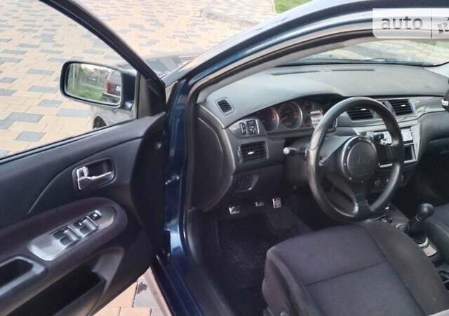 Синій Міцубісі Lancer, об'ємом двигуна 2 л та пробігом 211 тис. км за 3950 $, фото 18 на Automoto.ua