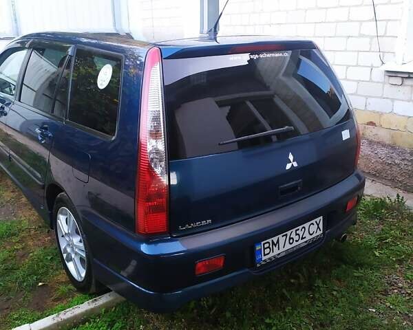 Синій Міцубісі Lancer, об'ємом двигуна 2 л та пробігом 201 тис. км за 4800 $, фото 21 на Automoto.ua