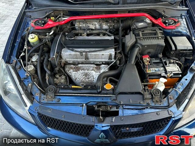 Синий Мицубиси Лансер, объемом двигателя 2 л и пробегом 330 тыс. км за 3400 $, фото 1 на Automoto.ua