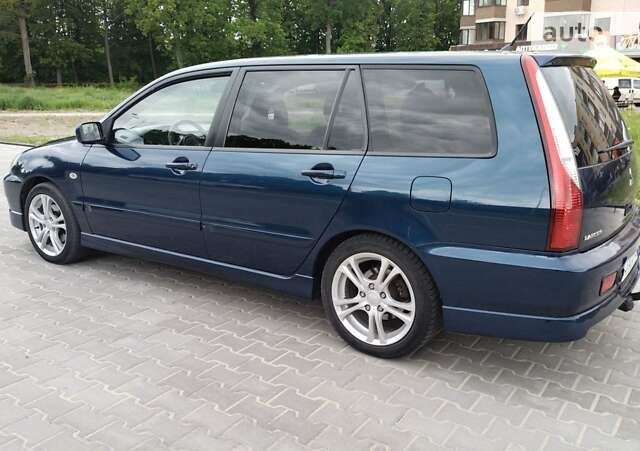 Синій Міцубісі Lancer, об'ємом двигуна 2 л та пробігом 211 тис. км за 3950 $, фото 13 на Automoto.ua