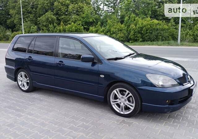 Синій Міцубісі Lancer, об'ємом двигуна 2 л та пробігом 211 тис. км за 3950 $, фото 5 на Automoto.ua