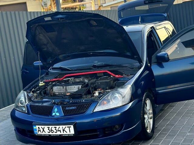 Синий Мицубиси Лансер, объемом двигателя 2 л и пробегом 330 тыс. км за 3400 $, фото 4 на Automoto.ua