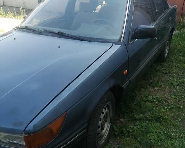 Синий Мицубиси Лансер, объемом двигателя 1.5 л и пробегом 227 тыс. км за 2200 $, фото 3 на Automoto.ua