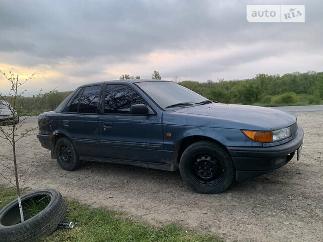 Синій Міцубісі Lancer, об'ємом двигуна 1.5 л та пробігом 352 тис. км за 1100 $, фото 1 на Automoto.ua