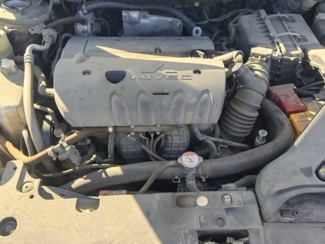 Синий Мицубиси Лансер, объемом двигателя 2.4 л и пробегом 185 тыс. км за 7300 $, фото 7 на Automoto.ua