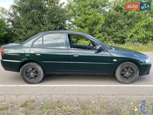 Зелений Міцубісі Lancer, об'ємом двигуна 1.3 л та пробігом 378 тис. км за 1750 $, фото 3 на Automoto.ua