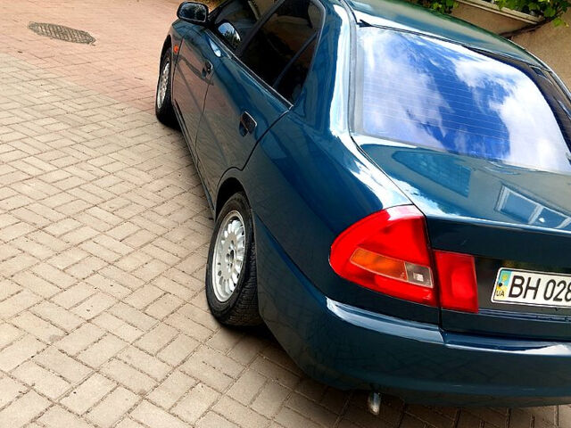 Зеленый Мицубиси Лансер, объемом двигателя 1.3 л и пробегом 300 тыс. км за 1550 $, фото 4 на Automoto.ua