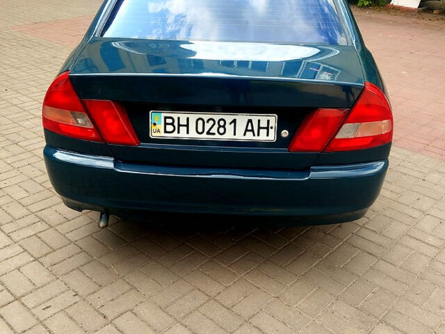 Зеленый Мицубиси Лансер, объемом двигателя 1.3 л и пробегом 300 тыс. км за 1550 $, фото 3 на Automoto.ua