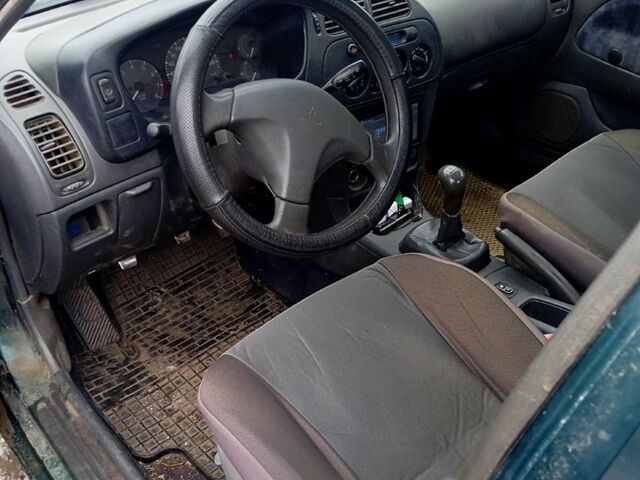 Мицубиси Лансер 1996 в Николаеве на Automoto.ua Зеленый Мицубиси Лансер, объемом двигателя 1.3 л и пробегом 100 тыс. км за 2000 $, фото 4 на Automoto.ua