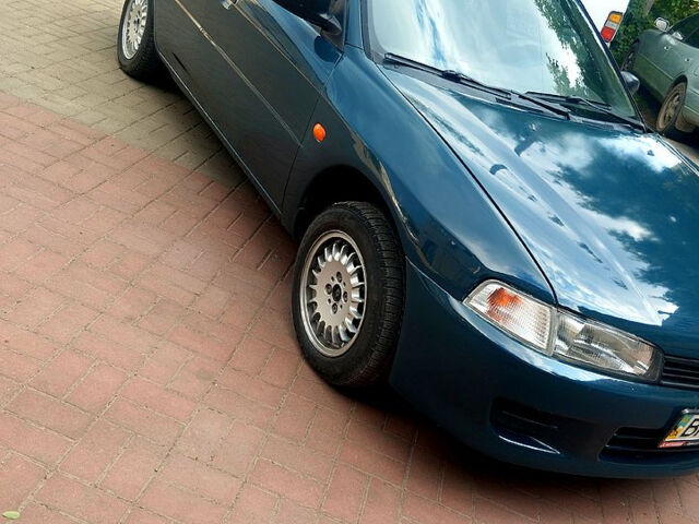 Зеленый Мицубиси Лансер, объемом двигателя 1.3 л и пробегом 300 тыс. км за 1550 $, фото 1 на Automoto.ua