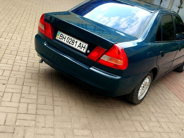 Зеленый Мицубиси Лансер, объемом двигателя 1.3 л и пробегом 300 тыс. км за 1550 $, фото 2 на Automoto.ua