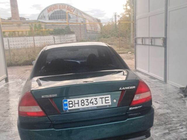 Зеленый Мицубиси Лансер, объемом двигателя 1.3 л и пробегом 400 тыс. км за 2300 $, фото 2 на Automoto.ua
