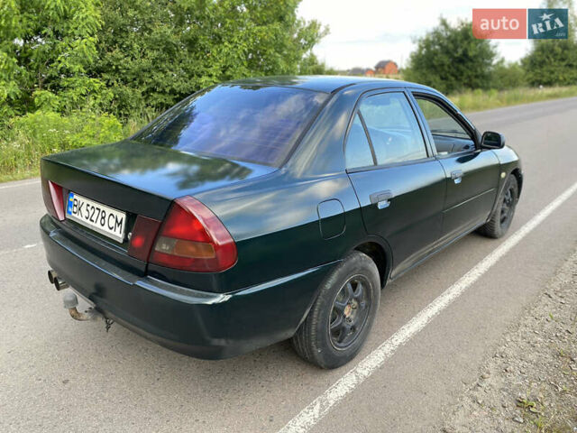 Зелений Міцубісі Lancer, об'ємом двигуна 1.3 л та пробігом 378 тис. км за 1750 $, фото 4 на Automoto.ua