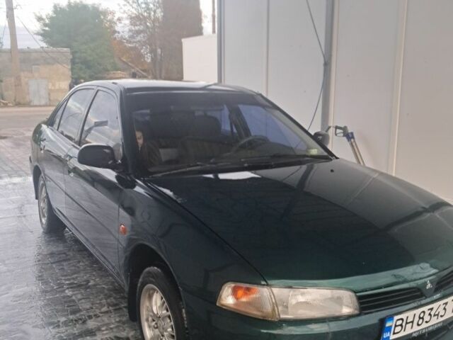 Зеленый Мицубиси Лансер, объемом двигателя 1.3 л и пробегом 400 тыс. км за 2300 $, фото 1 на Automoto.ua